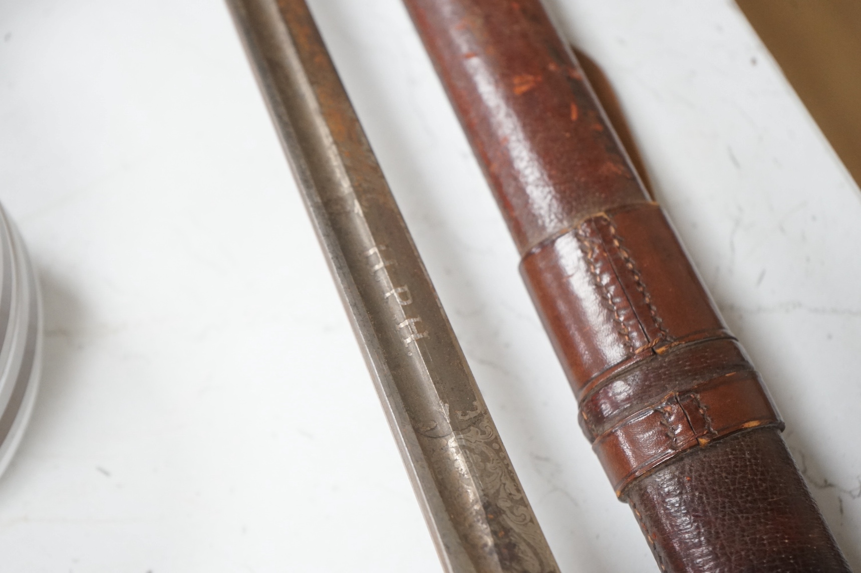 A 1911 pattern cavalry officer’s sword by J. Gaunt and son, etched with crowned GVR cipher and owner’s initials; HPH, regulation hilt and leather covered scabbard